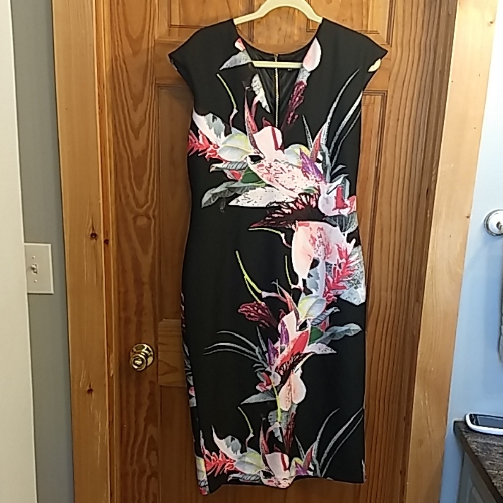 Black floral form fitting knee length dress